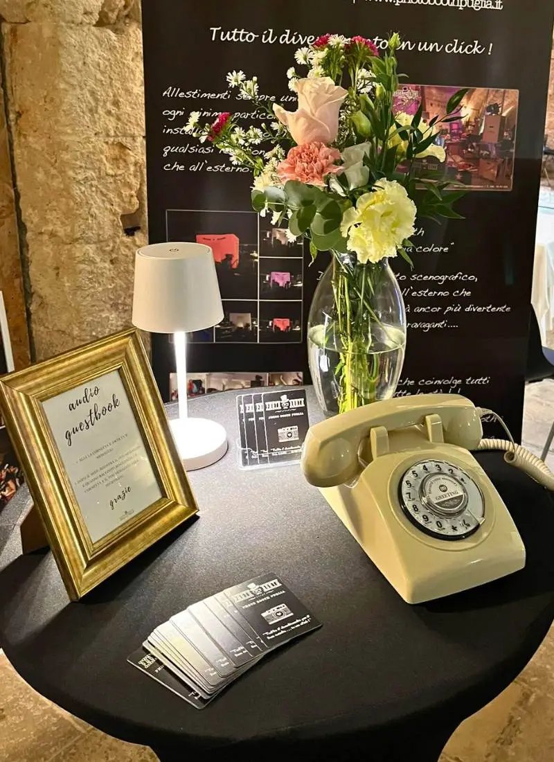 Audio guestbook table with a vintage phone at a wedding
