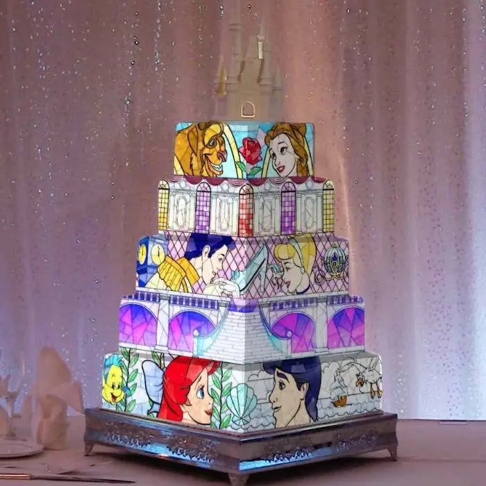 Colourful cake mapping projection at a wedding