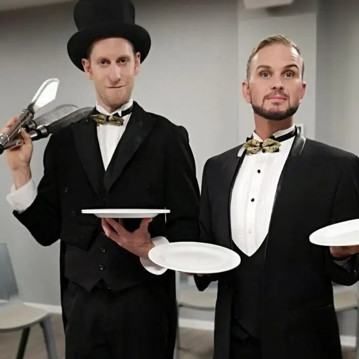Fake waiters entertaining wedding guests