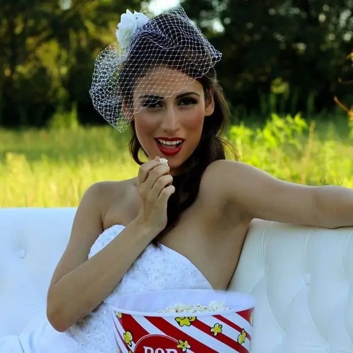 Bride enjoying popcorn at her wedding