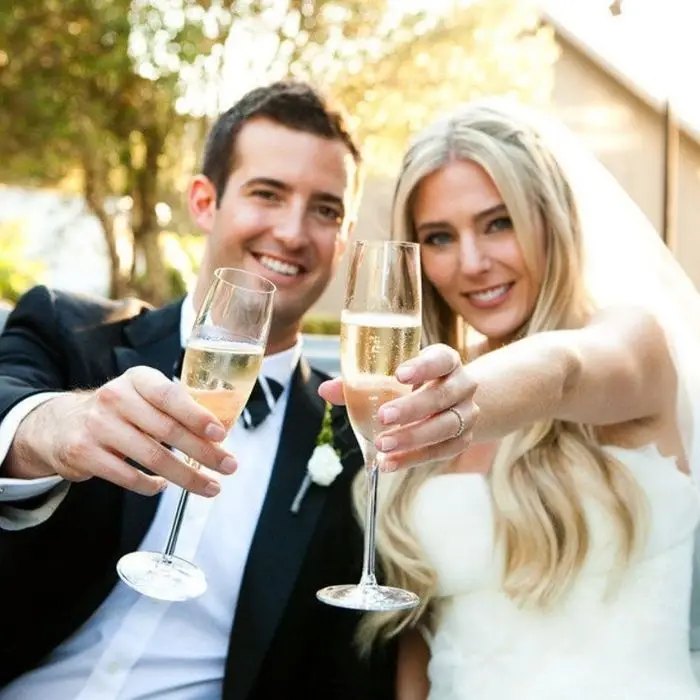 Couple toasting with prosecco at their wedding