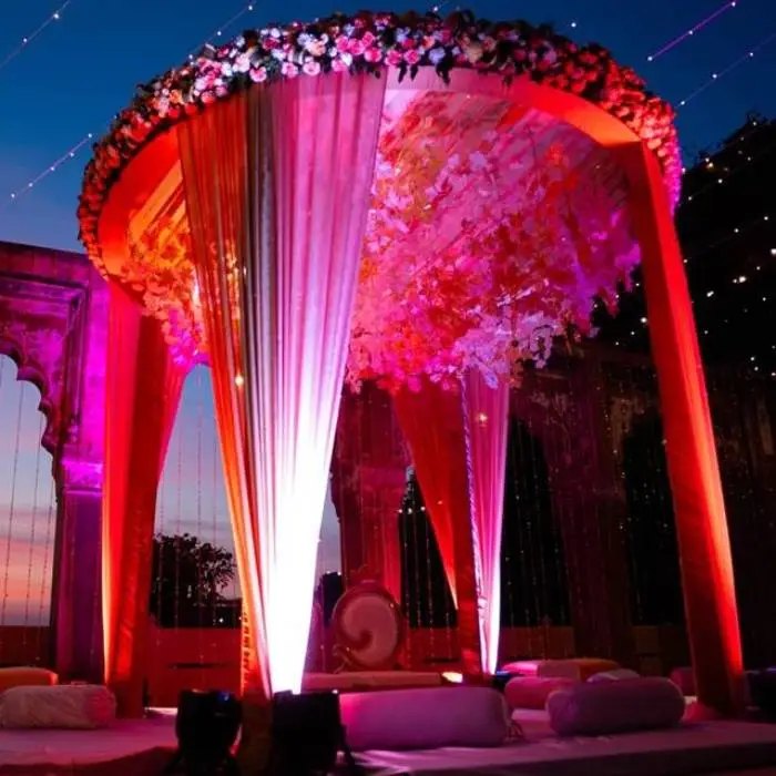 Uplights on draping at a wedding