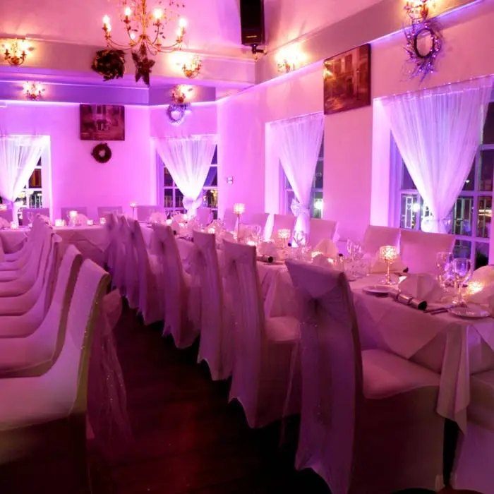Smart Bat uplighting in a wedding hall