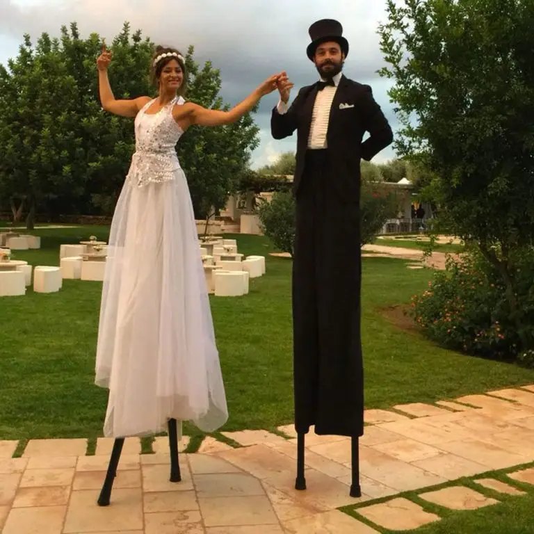 Stilt walkers at a wedding