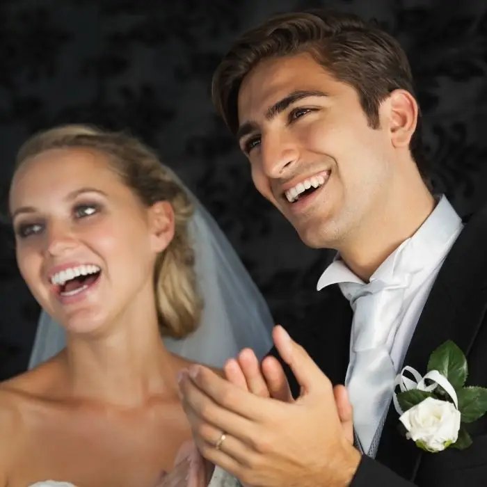 Couple laughing at the wedding quiz show